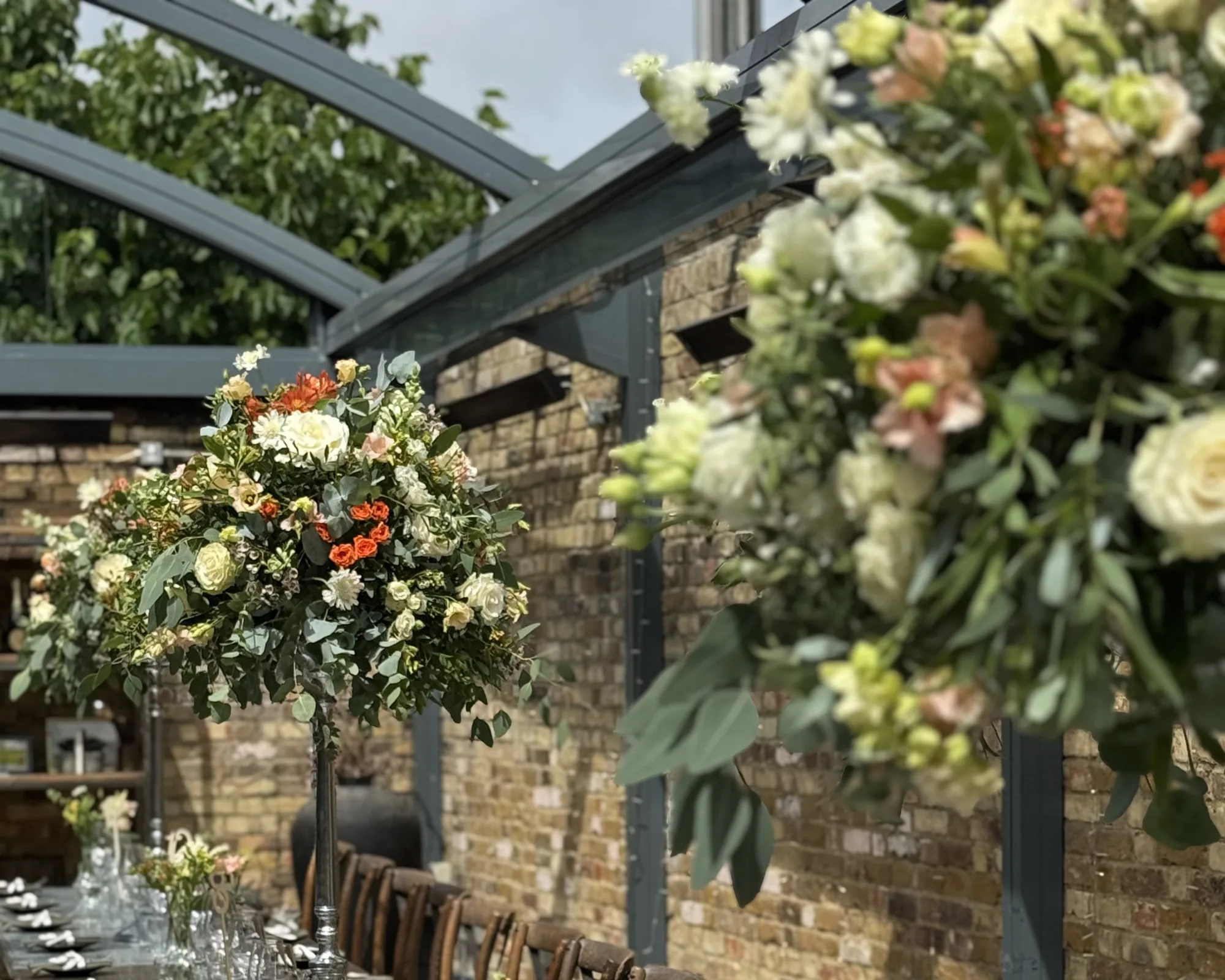 A long wedding table dressed with flowers
